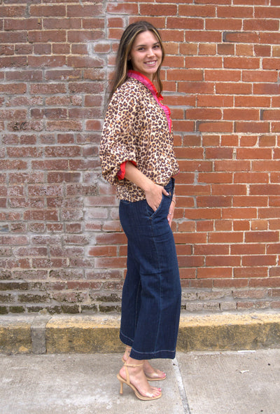 Women’s leopard print top with wavy stripe trim on long sleeves and relaxed fit