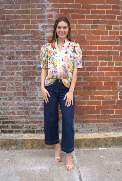Women’s floral puff sleeve top with contrast button-trimmed band collar, button-front closure, and lightweight semi-sheer fabric