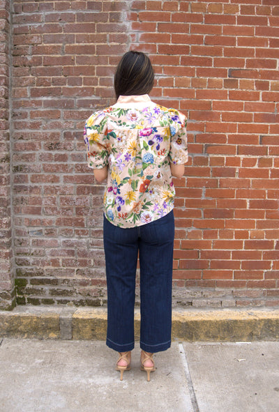 Women’s floral puff sleeve top with contrast button-trimmed band collar, button-front closure, and lightweight semi-sheer fabric