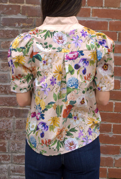 Women’s floral puff sleeve top with contrast button-trimmed band collar, button-front closure, and lightweight semi-sheer fabric