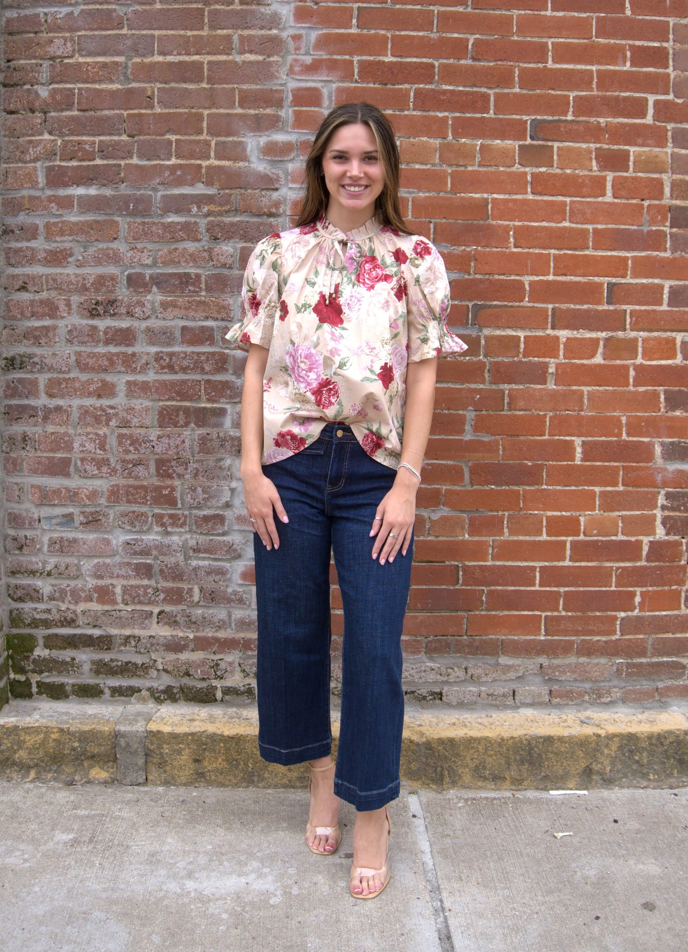 Women’s floral print top with smocked bodice, V-neckline, short puff sleeves, and ruffle trim details