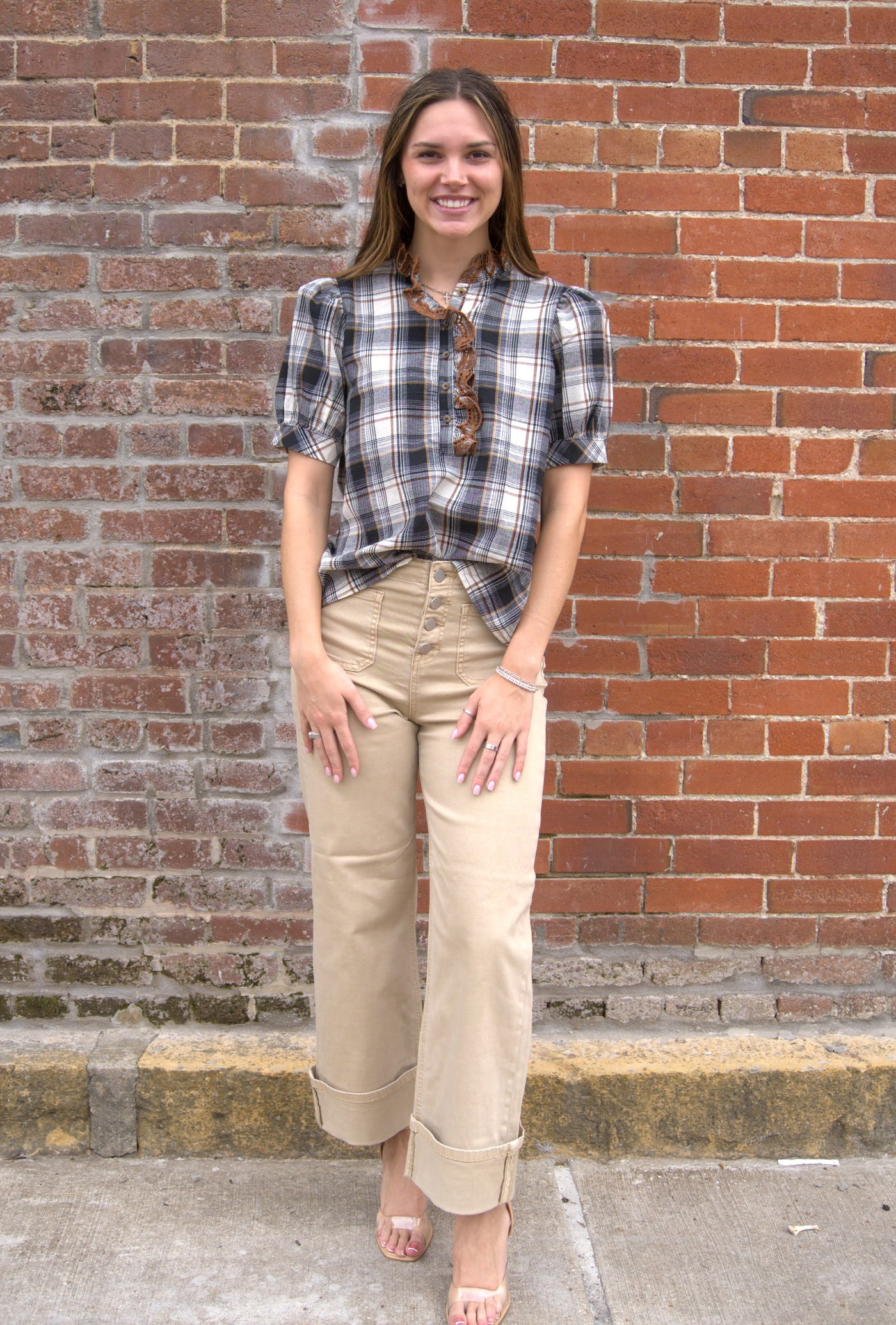 Women’s plaid puff sleeve top with button-front closure and contrast ruffle trim