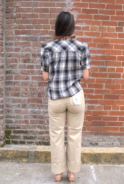 Women’s plaid puff sleeve top with button-front closure and contrast ruffle trim