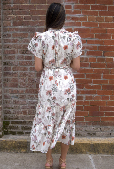 Women’s floral midi dress with flutter sleeves, ruffled V-neckline with tie, adjustable waist, and side pockets.