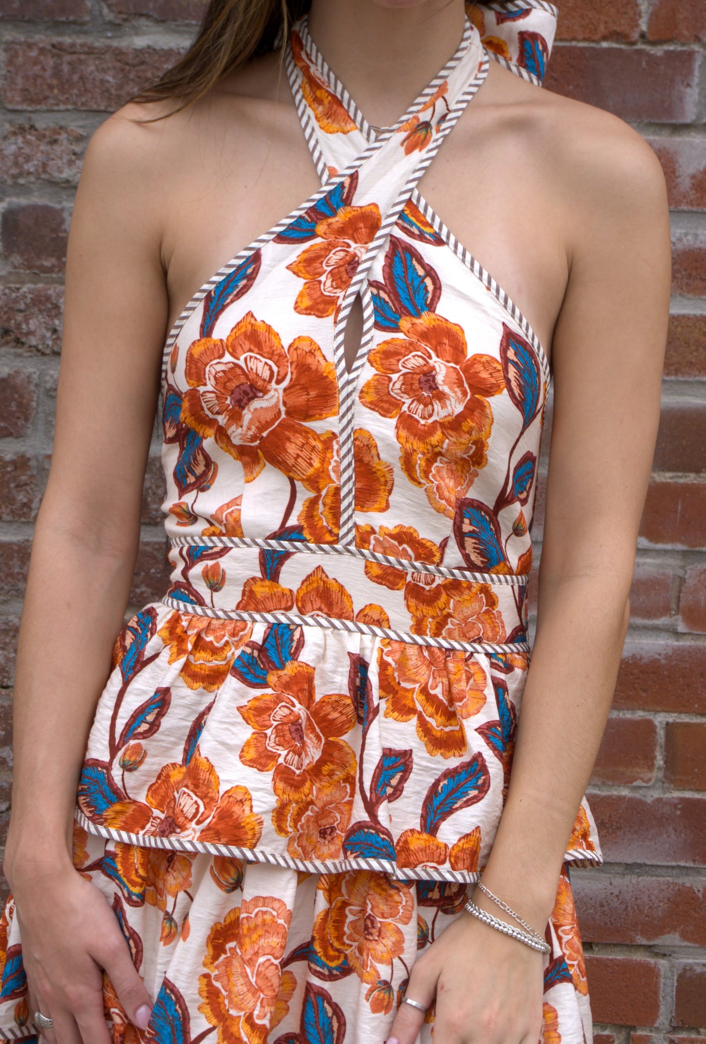 Women’s floral halter midi dress with bow tie neckline, contrast binding, smocked back, and tiered skirt