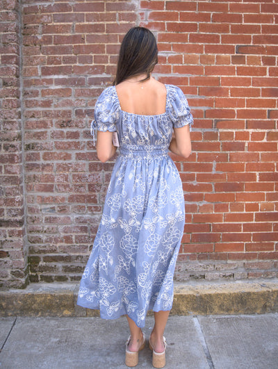 Floral Embroidered Midi Dress-A-Line,Bow Detail,Cinched Waist,clothing,Denim Blue,dresses,embroidered,Embroidered Detail,Floral,Floral Embroidery,Floral Print,Midi Dress,Puff Sleeve,Tie Neck,women's-[option4]-[option5]-[option6]-Bella Bliss Boutique in Texas